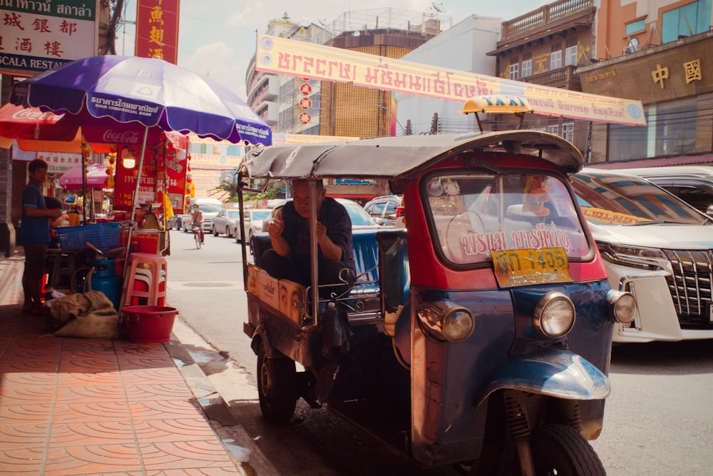 A tuk-tuk on a busy Bangkok street